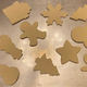 After cutting out the shapes, use a flat metal turner to carefully lift the cookies onto the baking sheet.